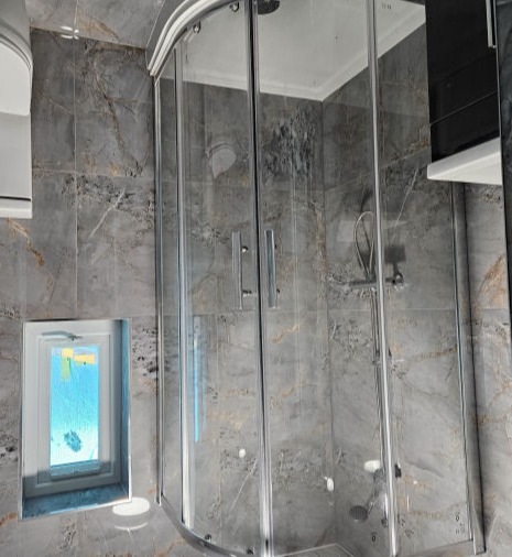 Corner Shower Enclosure in Renovated Bathroom